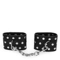 KINK - HANDGELENKFESSELN MIT DRUCKVERSCHLUSS VOLLER NIETEN SCHWARZ VERSTELLBAR 19-24 CM X 5,5 CM - Vanelion Paradise
