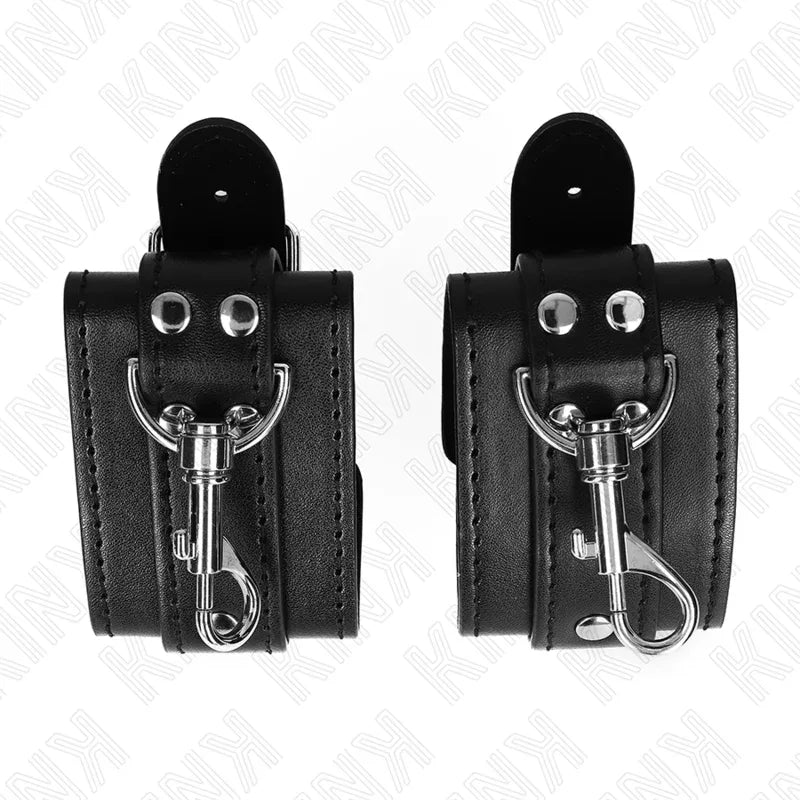 KINK - ABSCHLIEßBARE DUNGEON HANDGELENKSFESSELN SCHWARZ VERSTELLBAR 21-28 CM X 5,5 CM - Vanelion Paradise