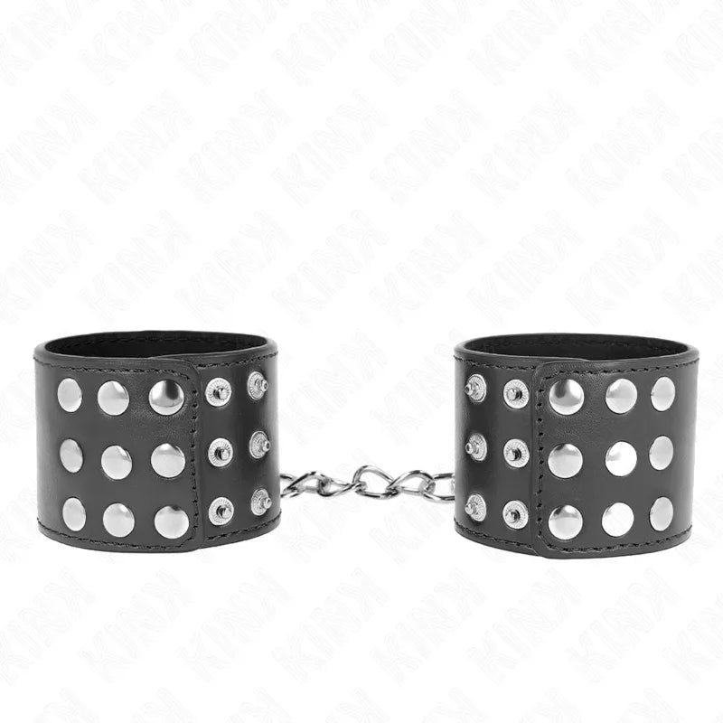 KINK - HANDGELENKFESSELN MIT DRUCKVERSCHLUSS SCHWARZ VERSTELLBAR 19-24 CM X 5,5 CM - Vanelion Paradise