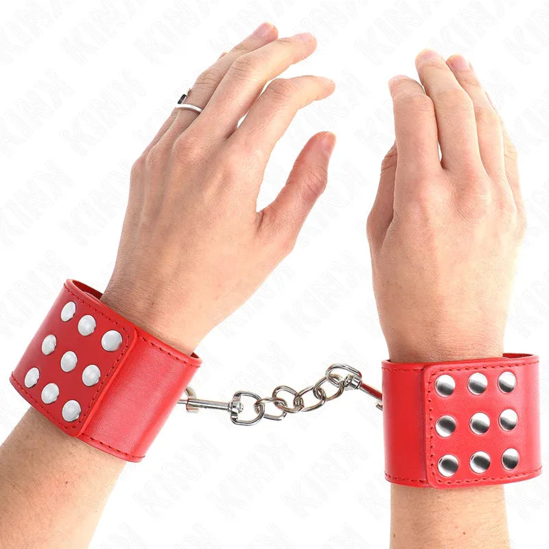 KINK - HANDGELENKFESSELN MIT DRUCKVERSCHLUSS ROT VERSTELLBAR 19-24 CM X 5,5 CM - Vanelion Paradise