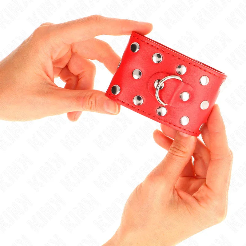 KINK - HANDGELENKFESSELN MIT DRUCKVERSCHLUSS VOLLER NIETEN ROT VERSTELLBAR 19-24 CM X 5,5 CM - Vanelion Paradise