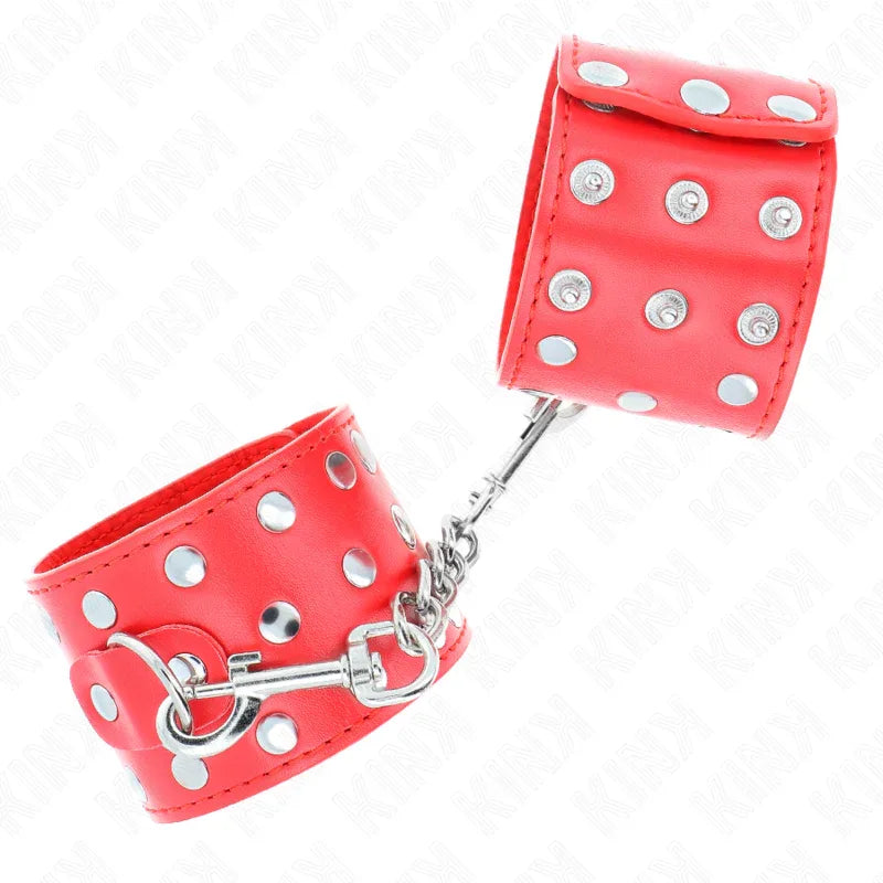 KINK - HANDGELENKFESSELN MIT DRUCKVERSCHLUSS VOLLER NIETEN ROT VERSTELLBAR 19-24 CM X 5,5 CM - Vanelion Paradise
