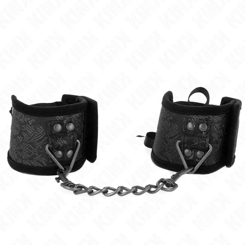 KINK - SCANDAL HANDGELENKSFESSELN SCHWARZE SPITZENDETAILS 24,5 CM X 6,5 CM - Vanelion Paradise
