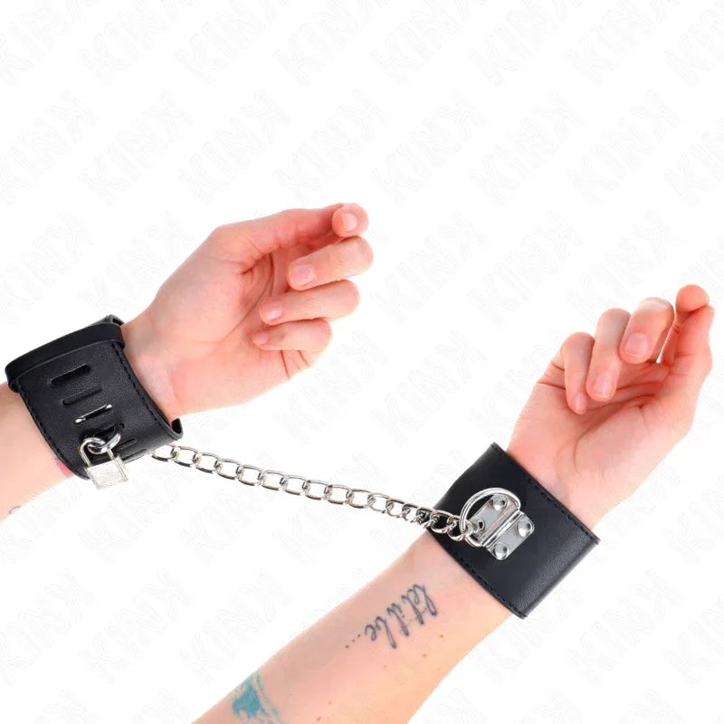 KINK - FESTE HANDGELENKFESSELN MIT KETTE 30 CM UND VORHÄNGESCHLOSS VERSCHLUSS SCHWARZ VERSTELLBAR 16-23 CM X 5,5 CM - Vanelion Paradise