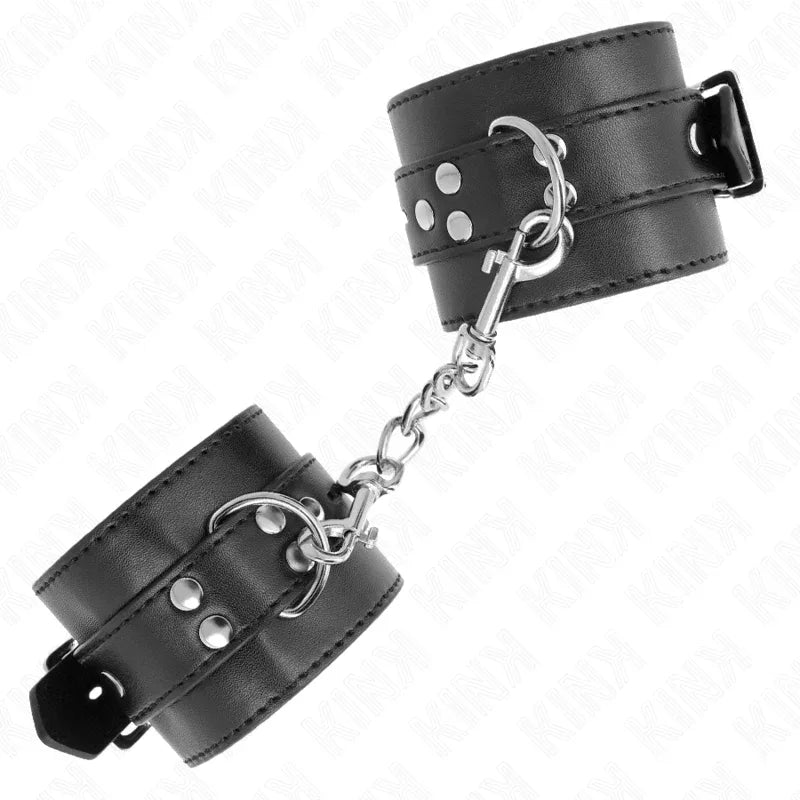 KINK - HANDGELENKFESSELN SCHWARZ MIT SCHWARZEM GÜRTEL VERSTELLBAR 17-28 CM X 6 CM - Vanelion Paradise