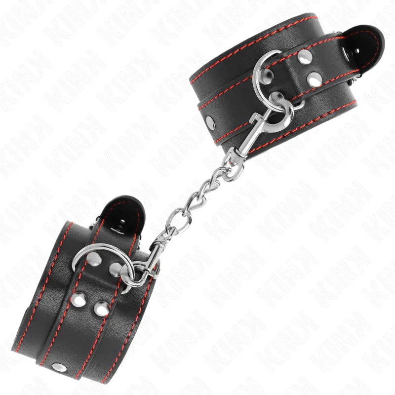KINK - HANDGELENKFESSELN SCHWARZ MIT ROTEM FUTTER VERSTELLBAR 20-28 CM X 5,5 CM - Vanelion Paradise