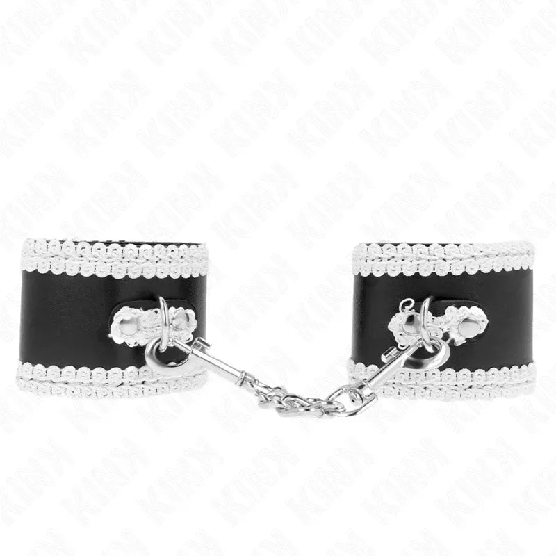 KINK - SCHWARZE HANDGELENKFESSELN MIT WEISSER DEKORIERTER SPITZE, VERSTELLBAR 20-23 CM X 5,5 CM - Vanelion Paradise