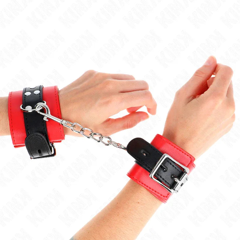 KINK - HANDGELENKFESSELN ROT MIT SCHWARZEM GÜRTEL VERSTELLBAR 17-28 CM X 6 CM - Vanelion Paradise